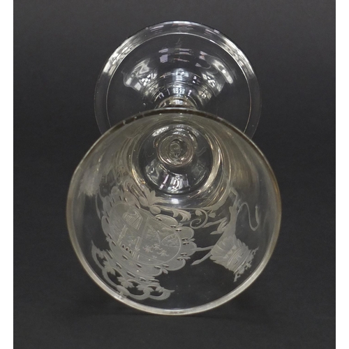 1 - 17th/18th century wine glass engraved with a coat of arms, having a baluster stem enclosing a tear a... 
