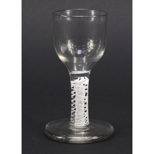 122 - 18th century firing glass with opaque twist stem, 11cm high