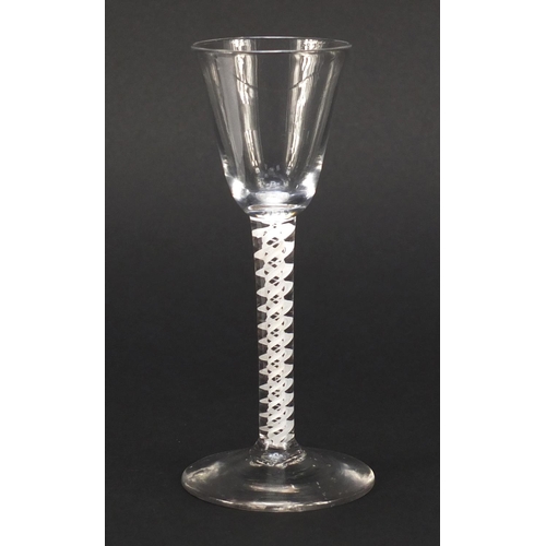 77 - 18th century wine glass with funnel bowl and multiple double series opaque twist stem, 15cm high