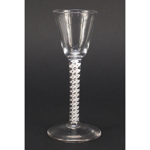 77 - 18th century wine glass with funnel bowl and multiple double series opaque twist stem, 15cm high