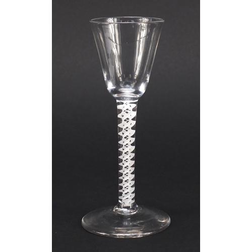 77 - 18th century wine glass with funnel bowl and multiple double series opaque twist stem, 15cm high