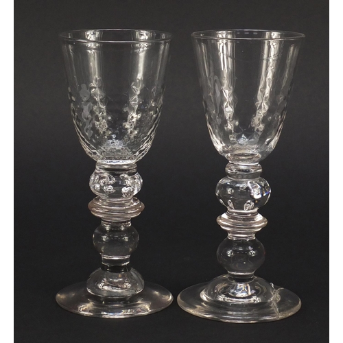 384 - Matched pair of early 19th century ale glasses with knopped baluster stems, each 16cm high