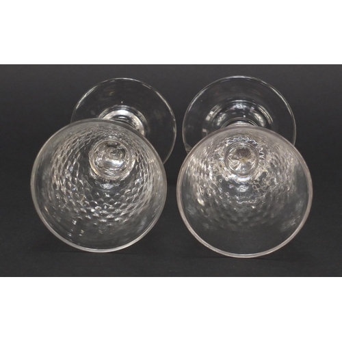 384 - Matched pair of early 19th century ale glasses with knopped baluster stems, each 16cm high