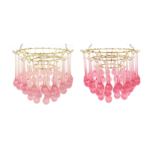 416 - Pair of retro brass three tier chandeliers with pink drops, each 20cm high x 26cm in diameter