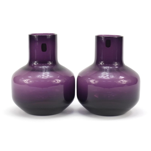 195 - Pair of Whitefriars mallet shaped amethyst glass vases with paper labels, each 17cm high