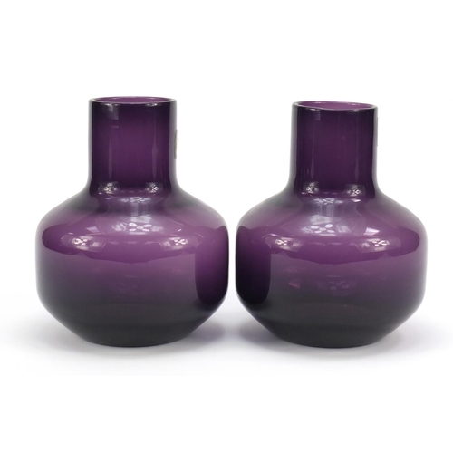 195 - Pair of Whitefriars mallet shaped amethyst glass vases with paper labels, each 17cm high