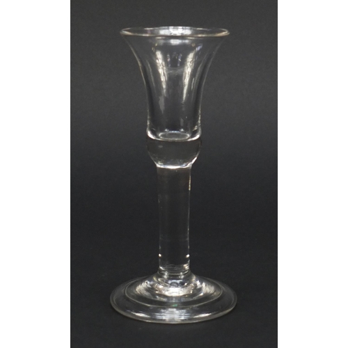 326 - 18th century wine glass with bell shaped bowl and folded foot, 15.2cm high