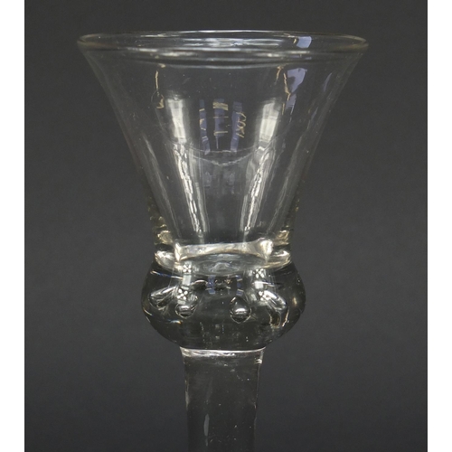 455 - 18th century baluster wine glass with trumpet bowl, shoulder knop enclosing tears and basal plain fo... 