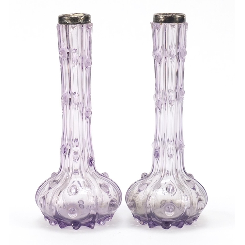 196 - Pair of Victorian silver topped mauve glass vases, each 21cm high