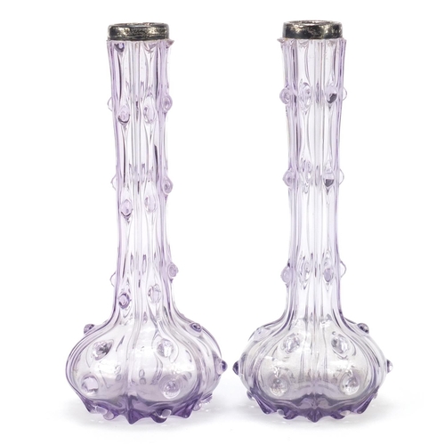 196 - Pair of Victorian silver topped mauve glass vases, each 21cm high