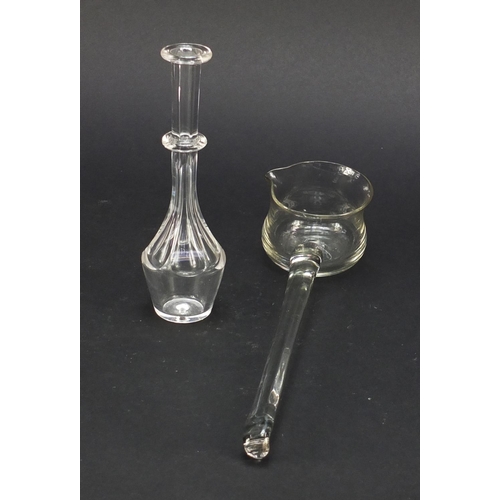 559 - 18th century glass punch ladel and a toddy lifter with faceted stem and ring collar, the largest 27.... 