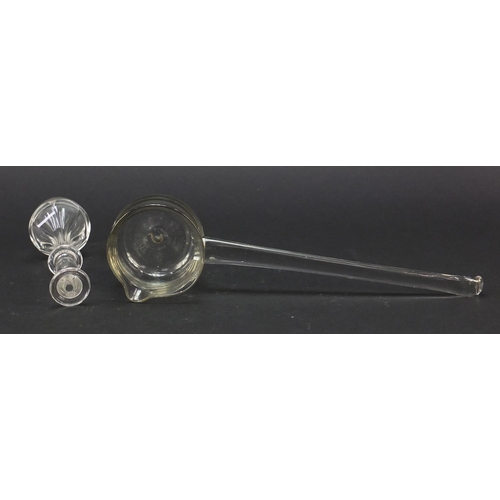 559 - 18th century glass punch ladel and a toddy lifter with faceted stem and ring collar, the largest 27.... 