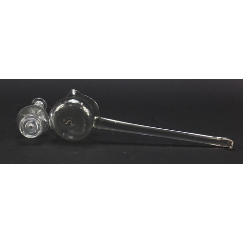 559 - 18th century glass punch ladel and a toddy lifter with faceted stem and ring collar, the largest 27.... 