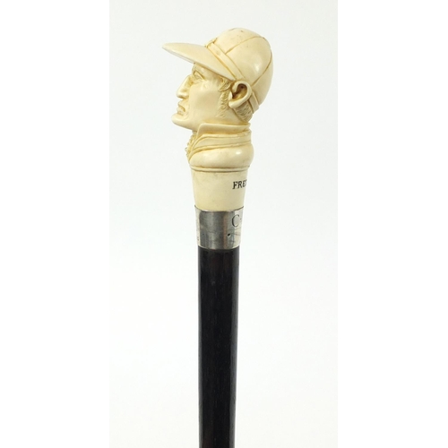 105 - Good ebonised walking stick with carved ivory pommel in the form of jockey Fred Archer, having a sil... 