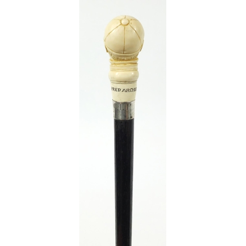 105 - Good ebonised walking stick with carved ivory pommel in the form of jockey Fred Archer, having a sil... 