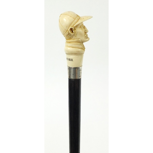 105 - Good ebonised walking stick with carved ivory pommel in the form of jockey Fred Archer, having a sil... 