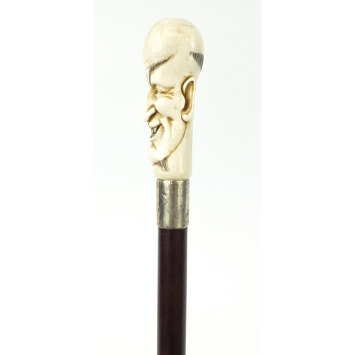 172 - Good snakewood walking stick with carved ivory pommel in the form of a man and ivory ferrule, 94cm i... 