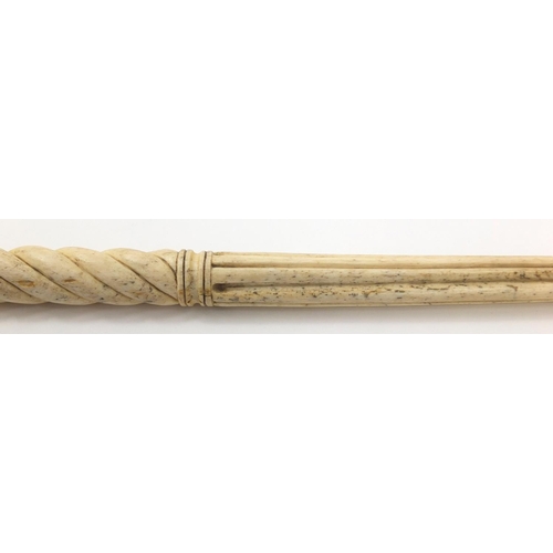 33 - Antique Scrimshaw carved whalebone walking stick with four pillars, 92.5cm in length
