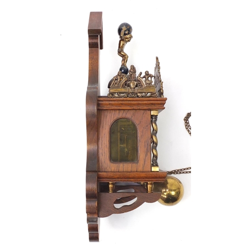 1030 - Mahogany atlas wall clock with brass mounts and weights, 50cm high