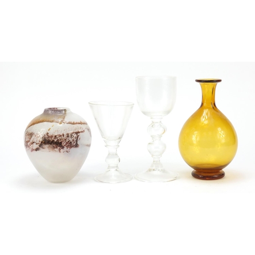 590 - Art Glassware by Liam Carey including two wine glasses with folded foots and knopped stems, the larg... 