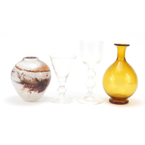 590 - Art Glassware by Liam Carey including two wine glasses with folded foots and knopped stems, the larg... 