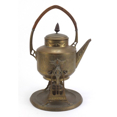 183 - Continental brass Arts and Crafts aesthetic kettle on stand with wicker handle, 44cm high