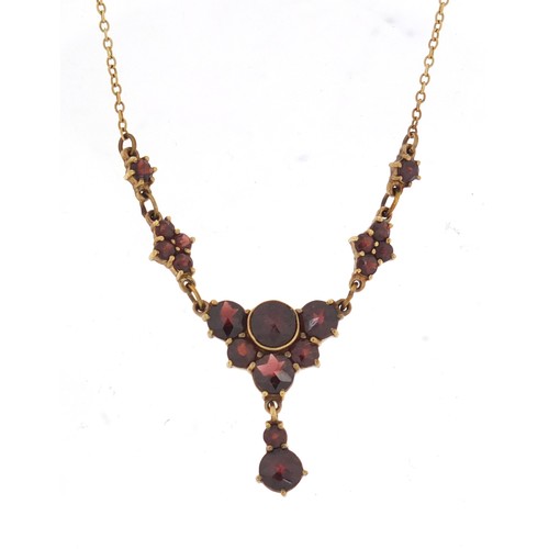 875 - 9ct gold garnet necklace, 40cm in length, 5.2g