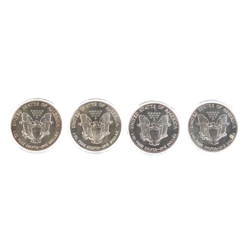 666 - Four American silver eagles with certificates of authenticity, comprising years 1990, 1991, 1992 and... 