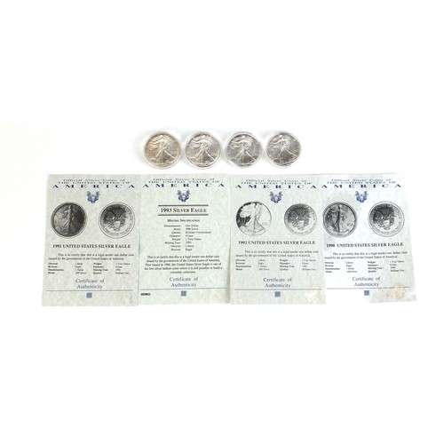 666 - Four American silver eagles with certificates of authenticity, comprising years 1990, 1991, 1992 and... 