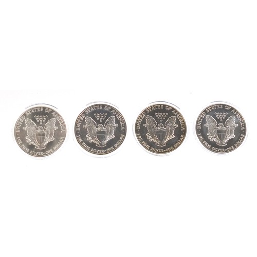 664 - Four American silver eagles with certificates of authenticity, comprising years 1986, 1987, 1988 and... 