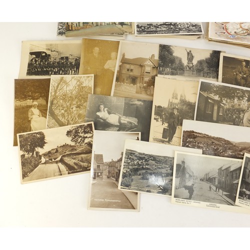 1313 - Edwardian and later postcards, some black and white photographic including street scenes, military s... 