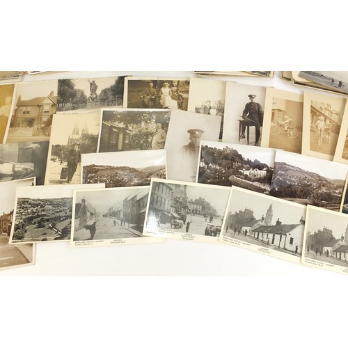 1313 - Edwardian and later postcards, some black and white photographic including street scenes, military s... 