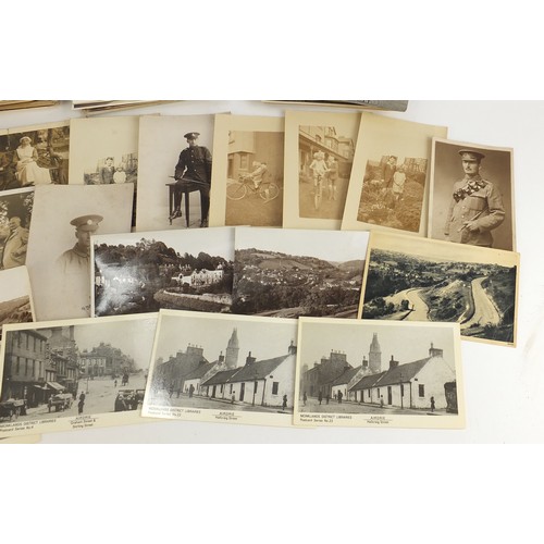 1313 - Edwardian and later postcards, some black and white photographic including street scenes, military s... 