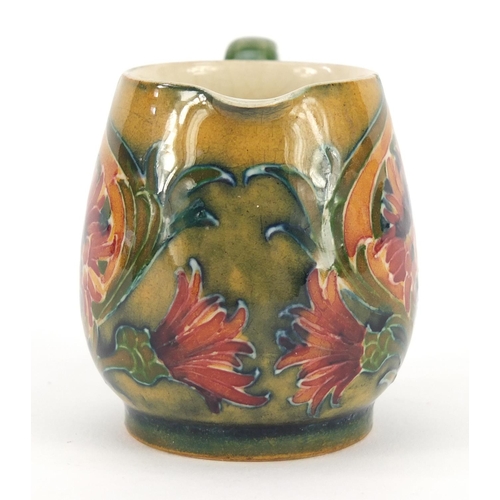 138 - William Moorcroft miniature jug hand painted in the Revived Cornflower pattern, 5.3cm high