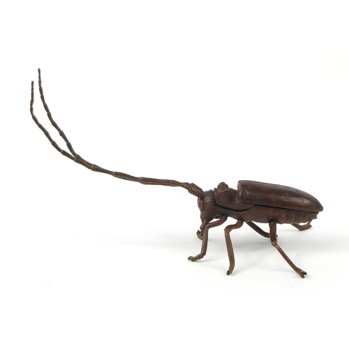 500 - Japanese patinated bronze locust with articulated antennae, wings and legs, 12cm in length