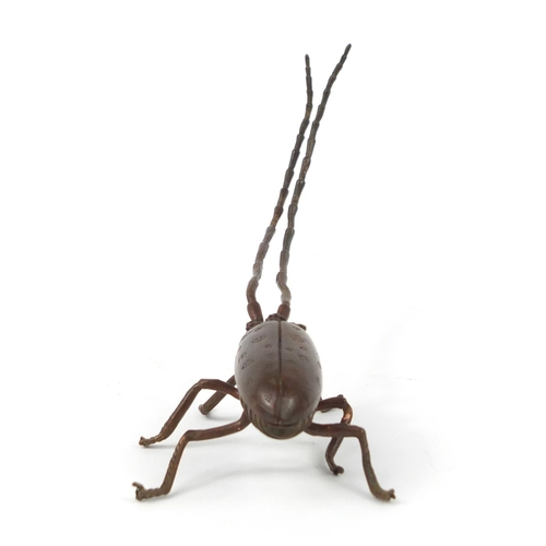 500 - Japanese patinated bronze locust with articulated antennae, wings and legs, 12cm in length