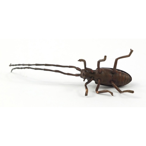 500 - Japanese patinated bronze locust with articulated antennae, wings and legs, 12cm in length