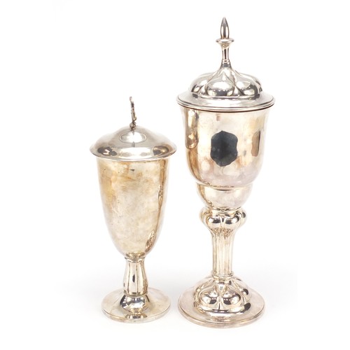 80 - Two silver plated lidded communion chalices, the largest 39.5cm high