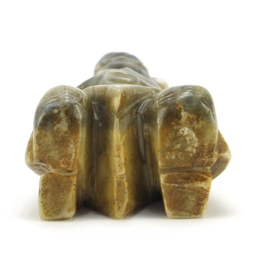 527 - Asian green hardstone carving of an archaic figure kneeling, 19cm high