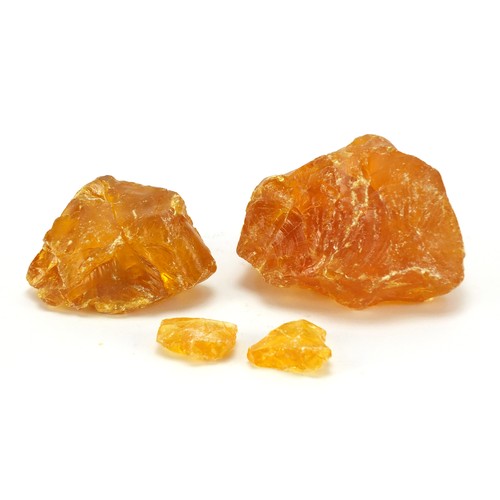 1455 - Four blocks of Baltic amber, the largest 12cm wide, 667.0g