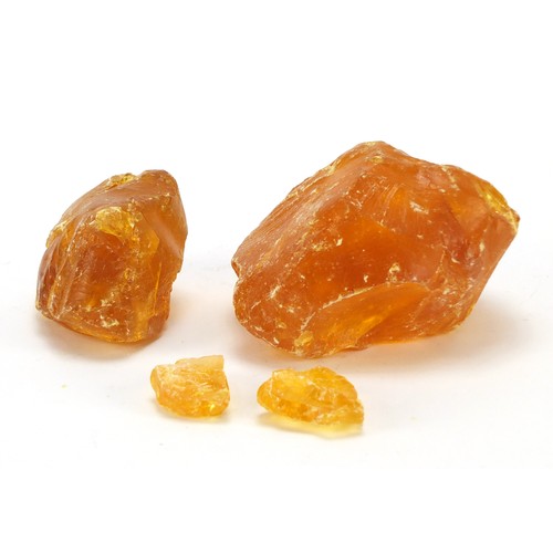 1455 - Four blocks of Baltic amber, the largest 12cm wide, 667.0g