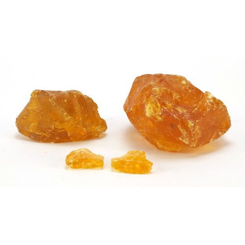 1455 - Four blocks of Baltic amber, the largest 12cm wide, 667.0g