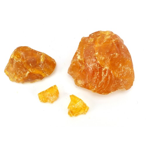 1455 - Four blocks of Baltic amber, the largest 12cm wide, 667.0g