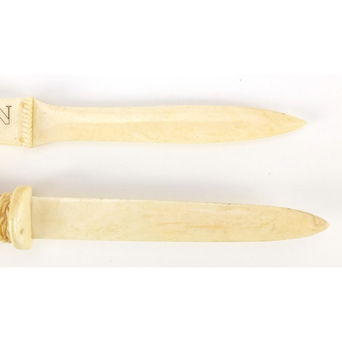 1088 - Two carved bone letter openers including one advertising Paragon Golf Construction, the largest 23cm... 