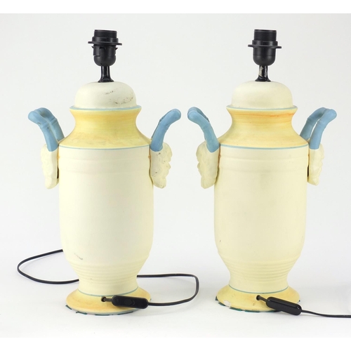 950 - Pair of classical style painted porcelain table lamps with grotesque twin handles, each 47cm high