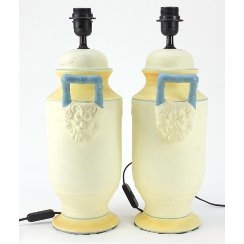 950 - Pair of classical style painted porcelain table lamps with grotesque twin handles, each 47cm high