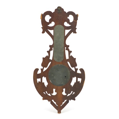 1066 - Carved Black Forest wall barometer and thermometer with Cyrillic script, 46cm high