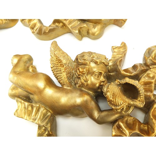 1089 - Two gilt cherub and ribbon design wall plaques, each 34.5cm wide