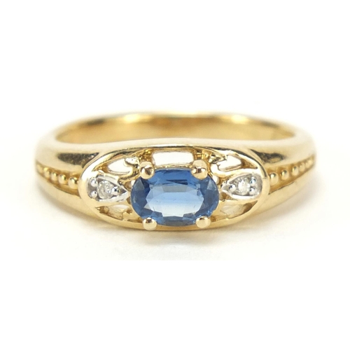 1187 - 9ct gold blue topaz and diamond three stone ring, size N, 3.0g