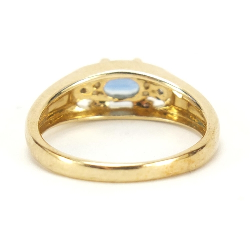 1187 - 9ct gold blue topaz and diamond three stone ring, size N, 3.0g